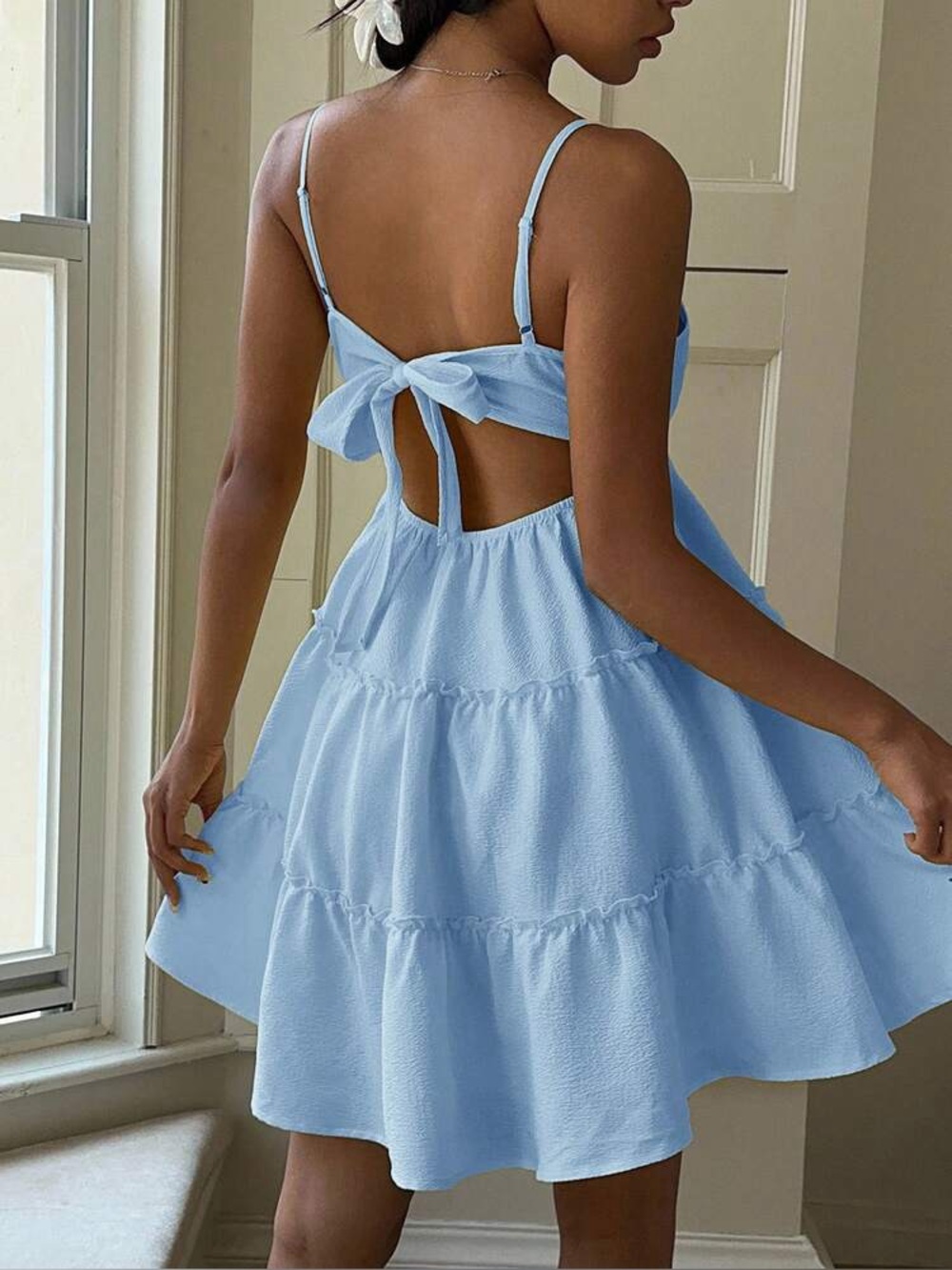 Light blue ruffle dress with bow accent